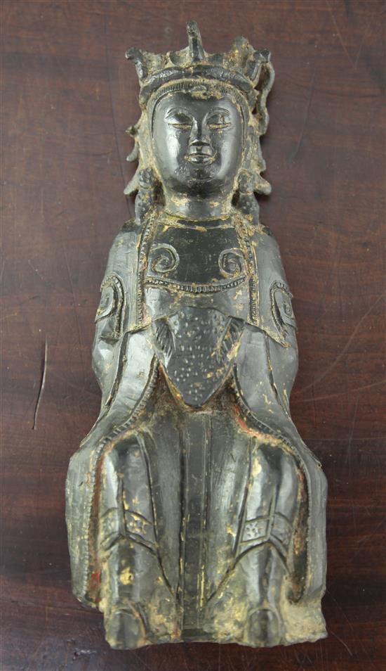 A Chinese late Ming bronze figure of a Buddhist saint or immortal, early 17th century, 28.5cm.